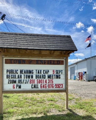 Town Sign with Meeting Details
